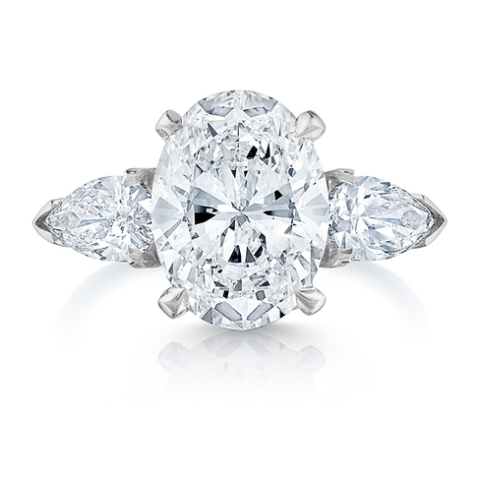 OVAL THREE STONE RING WITH PEAR SHAPE SIDES